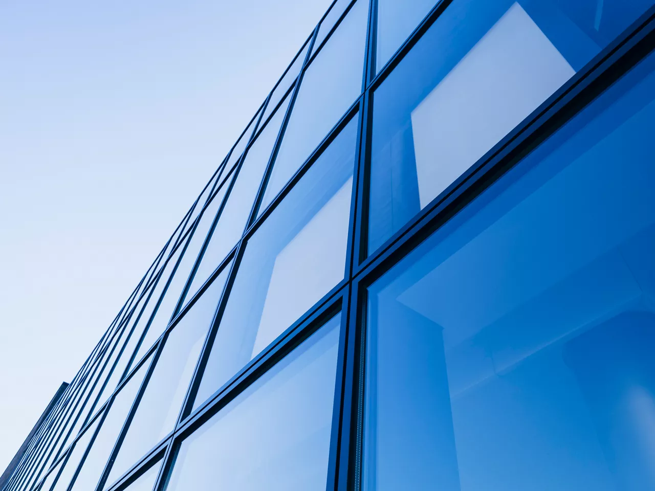 Architecture detail Modern Glass facade Background Blue tone